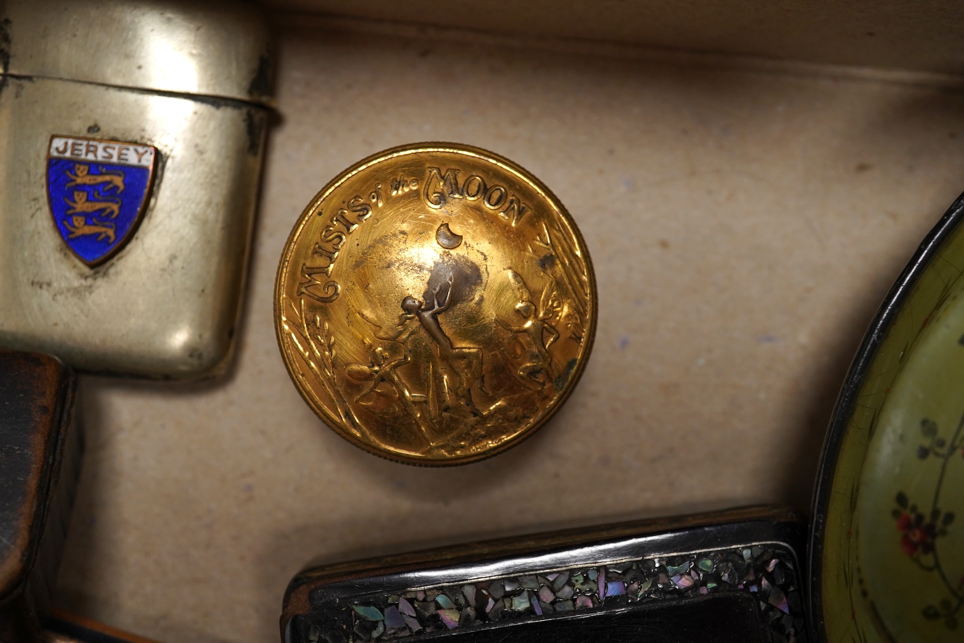 A collection of objects of vertu including snuff boxes, a pair of miniature oval trays, a silver mounted clock and photo frame, etc.